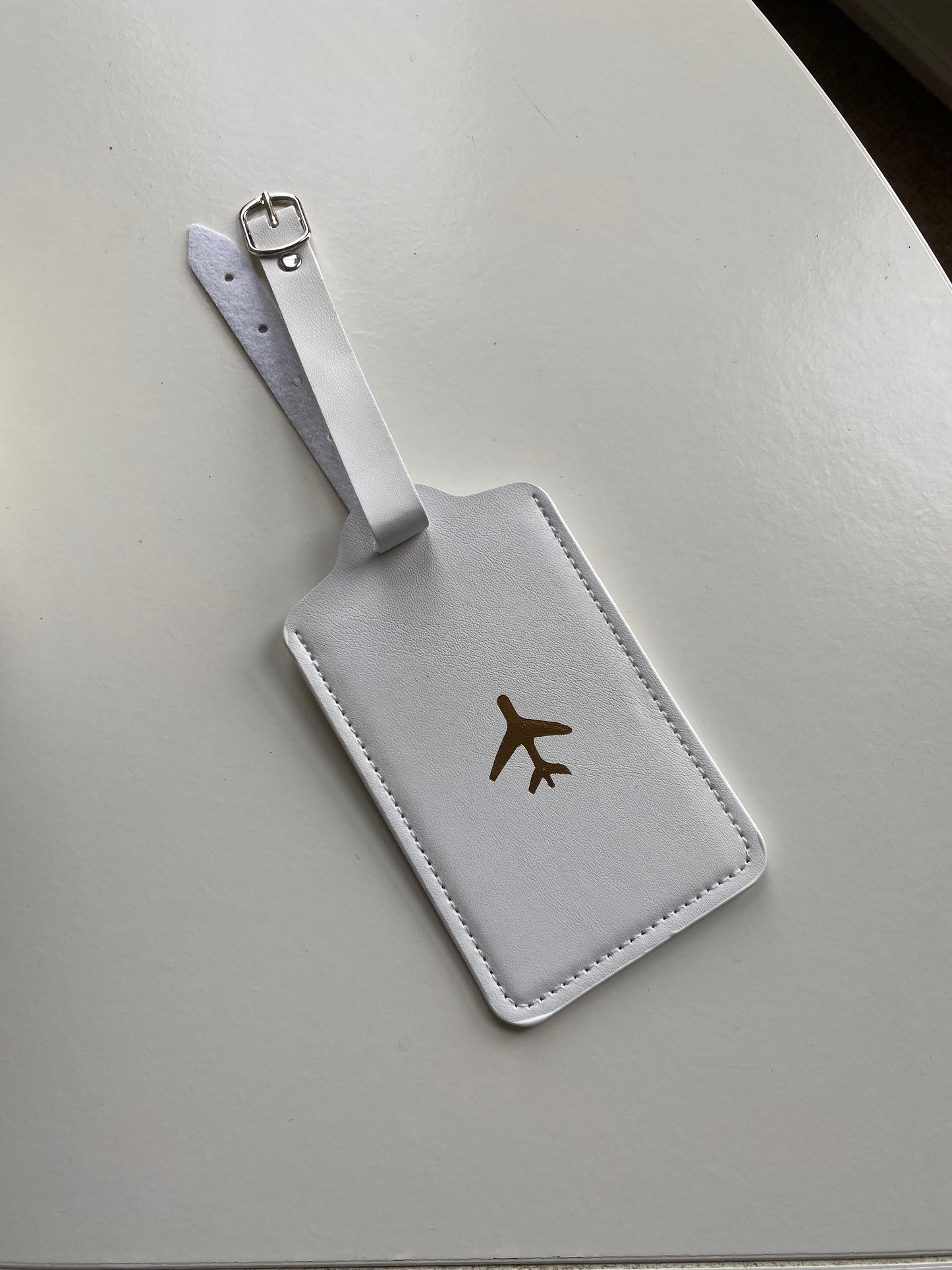 Simple white airplane luggage tag