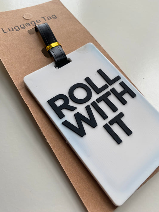 'Roll with it' luggage tag